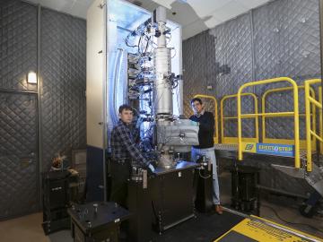 From left, Andrew Lupini and Juan Carlos Idrobo use ORNL’s new monochromated, aberration-corrected scanning transmission electron microscope, a Nion HERMES to take the temperatures of materials at the nanoscale. Image credit: Oak Ridge National Laboratory From left, Andrew Lupini and Juan Carlos Idrobo use ORNL’s new monochromated, aberration-corrected scanning transmission electron microscope, a Nion HERMES to take the temperatures of materials at the nanoscale. Image credit: Oak Ridge National Laboratory